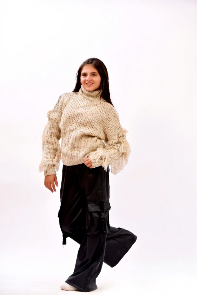 fringe detailing along the sleeves and sides sweater
