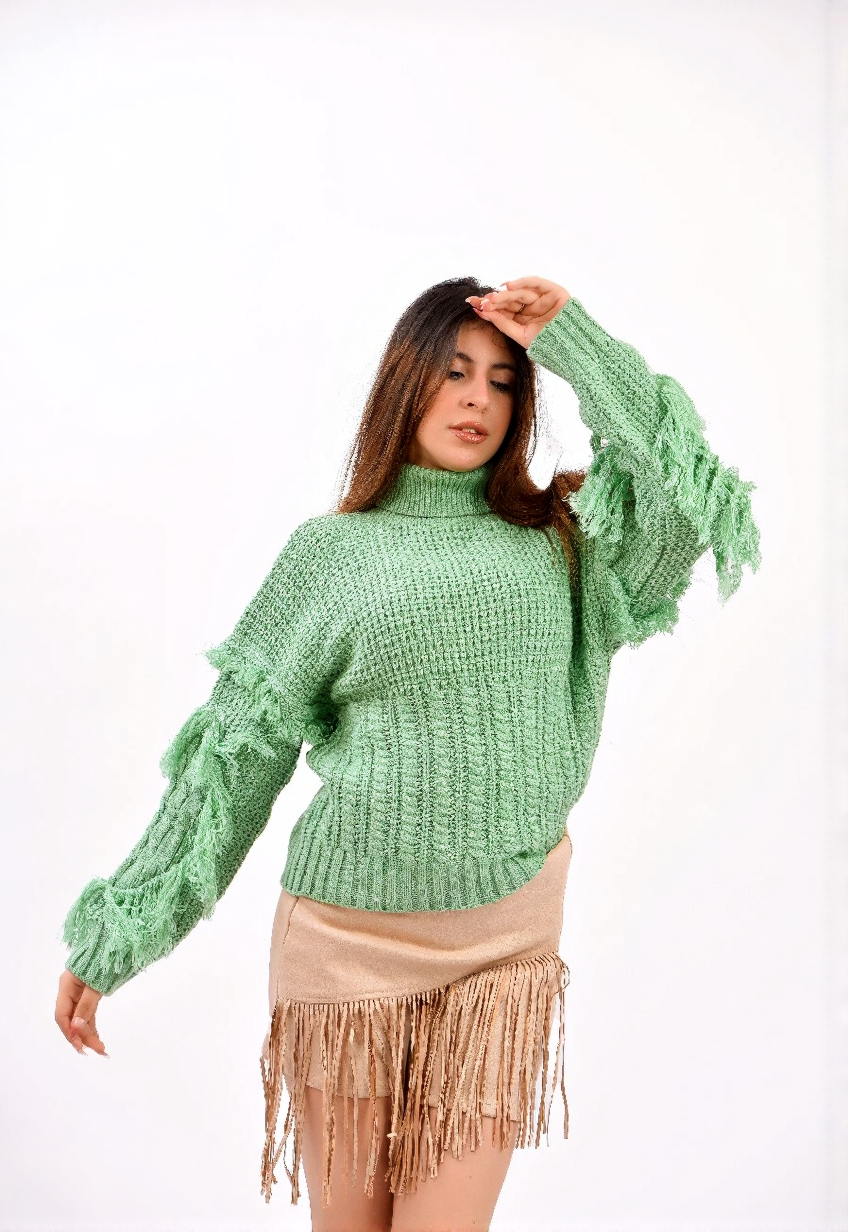 fringe detailing along the sleeves and sides sweater
