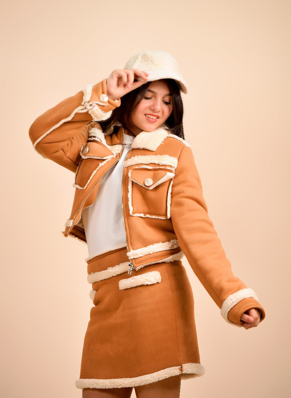 jacket paired with a matching mini skirt